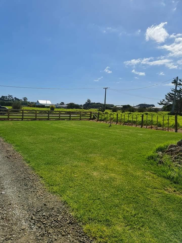 Post and rail fencing along a rural paddock with open pasture